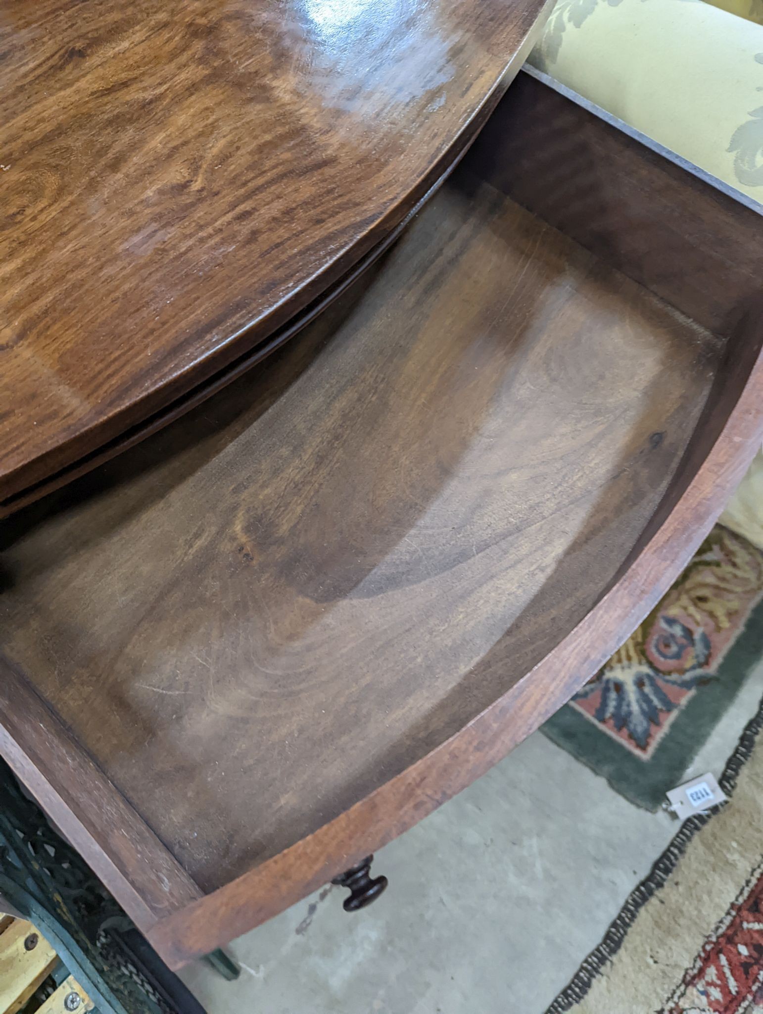 A small reproduction mahogany bow front chest of four long drawers, width 60cm, depth 38cm, height 82cm